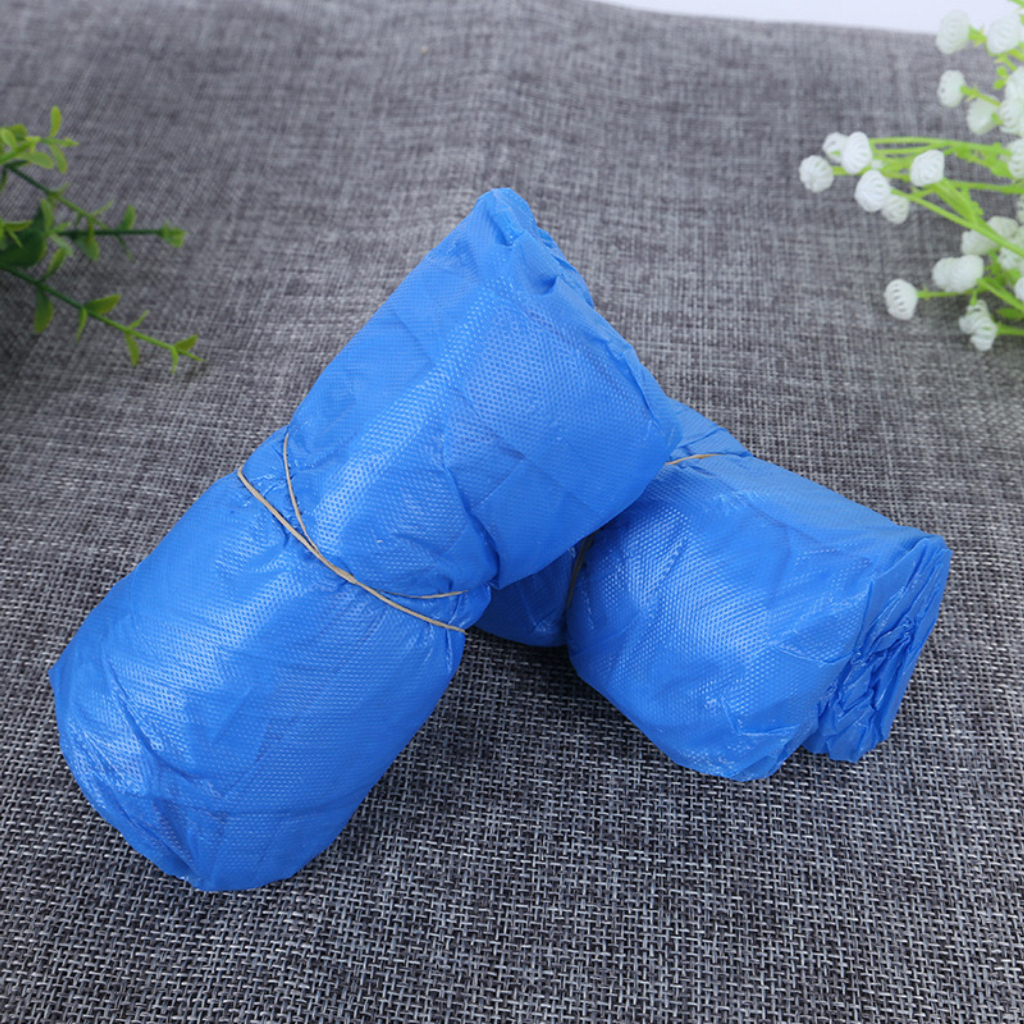 Sarung Sepatu Plastik Shoes Cover APD Pelindung Sepatu Anti Air Hujan Sekali Pakai Extra Tebal Isi 100 pcs (50 Pasang)