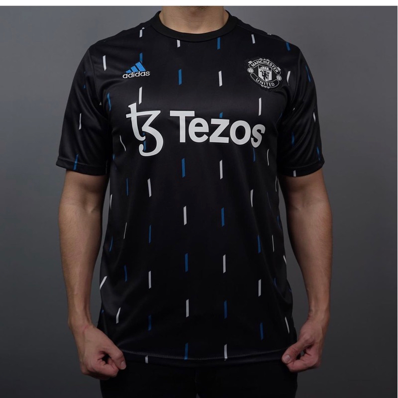 jersey manchester prematch hitam tezos