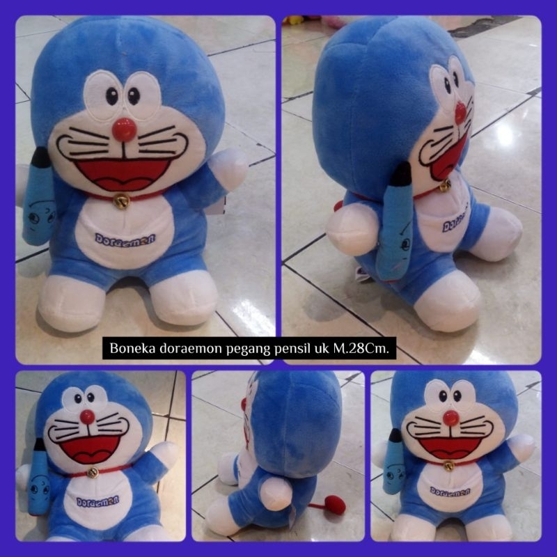 

Boneka doraemon pegang pensil uk M.28Cm.