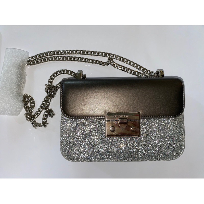 preloved new charles and keith glitter metallic push lock bag tas pesta cnk new