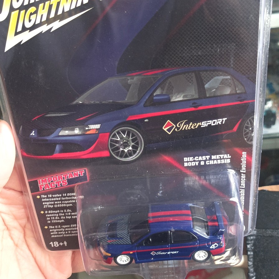 JOHNNY LIGHTNING INTERSPORT MITSUBISHI LANCER EVO 2003