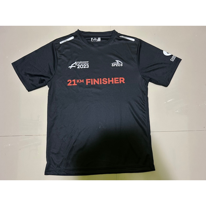 Baju lari finisher tee Makassar half marathon 2023