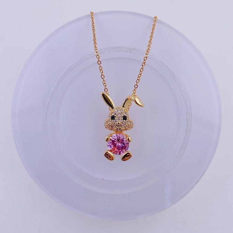 kalung titanium fashion kelinci mata pink dan putih