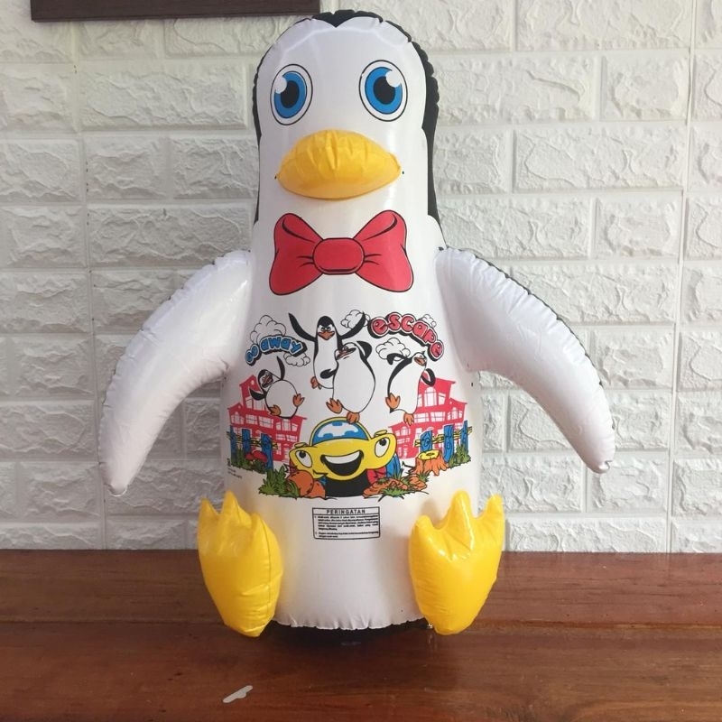 Tiupan Pinguin Tinju Pasir/air