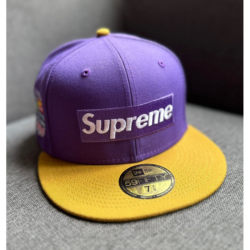 New Era Caps (topi) “SUPREME”