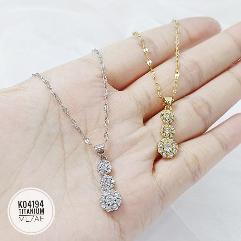 Kalung Titanium permata 3 tingkat gold K04194