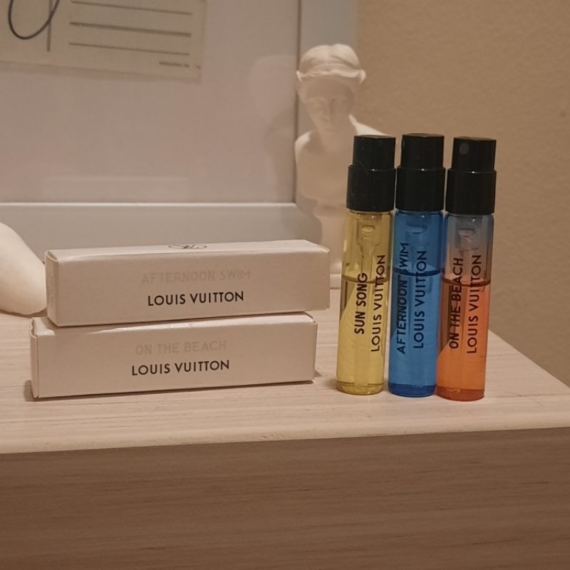 Vial perfume parfum original louis vuitton on the beach afternoon swim sun song