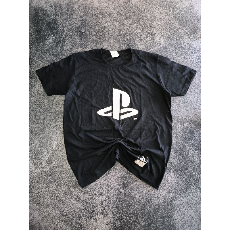 KAOS TSHIRT COSPA PLAYSTATION OFFICIAL LICENSED PRODUCT