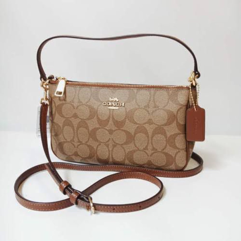 Coach pouch top handle signature