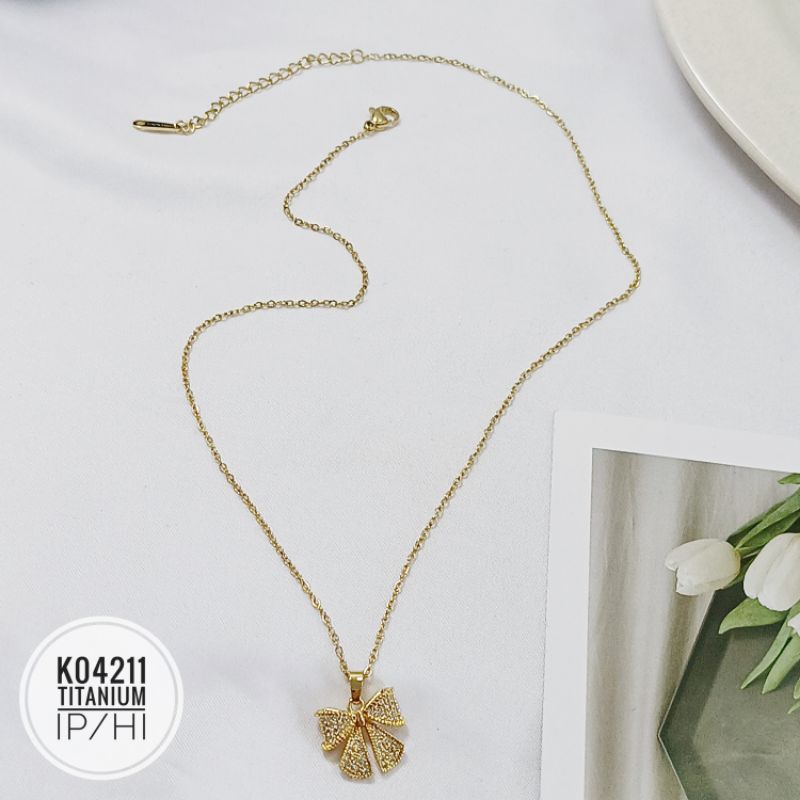 Kalung titanium pita gold K04211