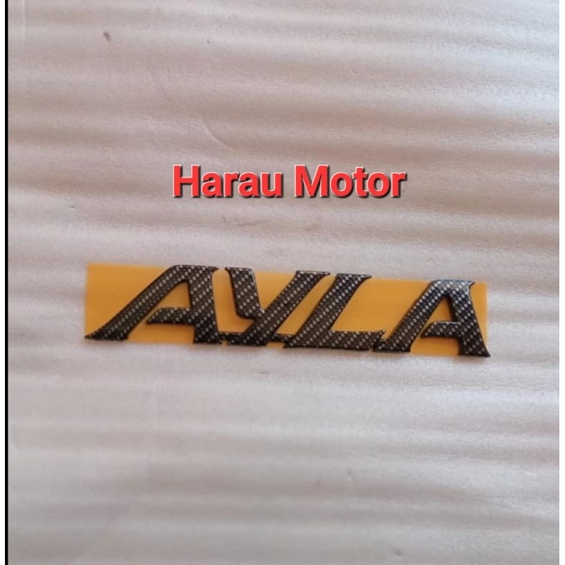 emblem tulisan daihatsu ayla carbon