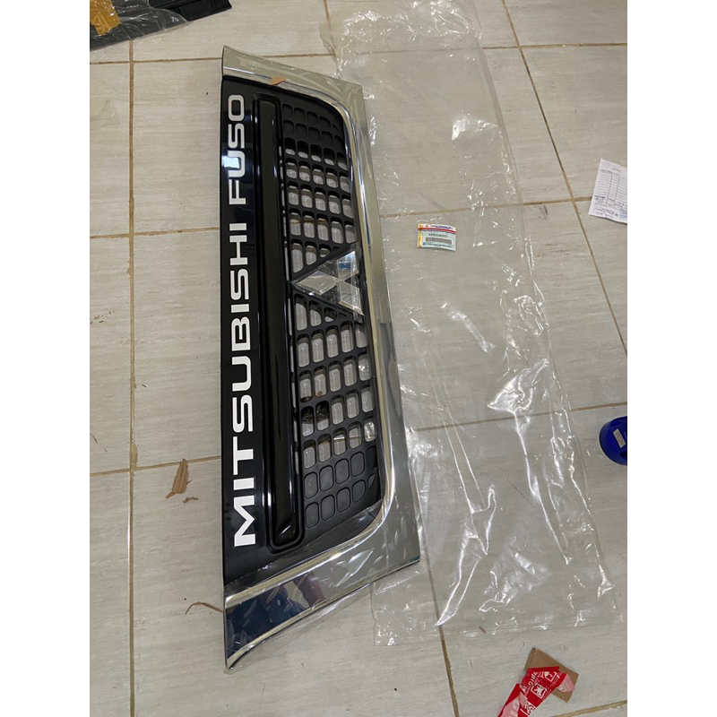 GRIL DEPAN MITSUBSHI CANTER PS 125.110 ORIGINAL