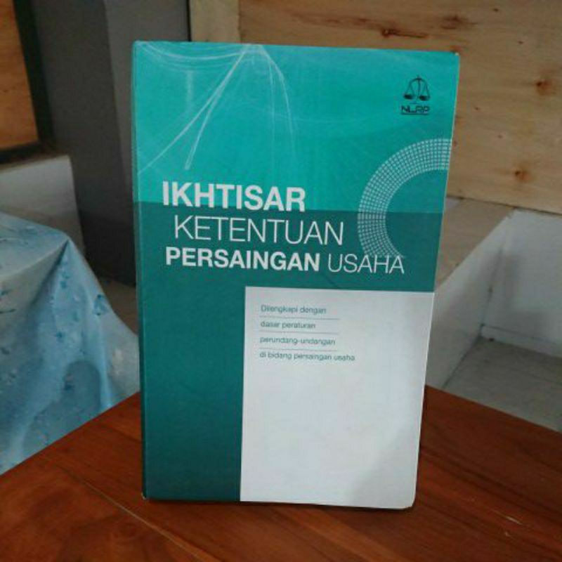 IKHTISAR KETENTUAN PERSAINGAN USAHA