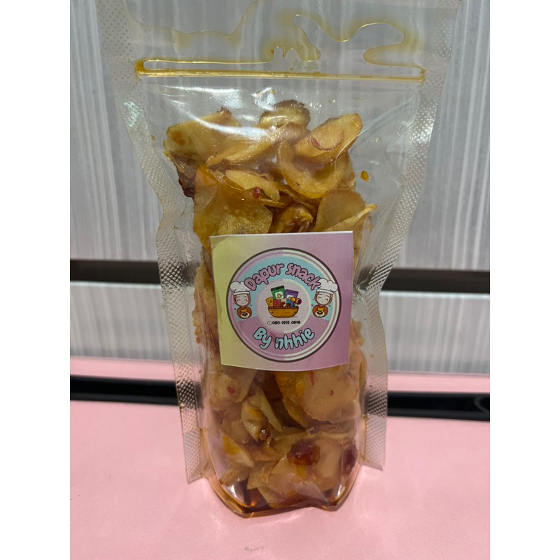 

CEMILAN ENAK KERIPIK SINGKONG PEDAS KEMASAN 150 GRAM