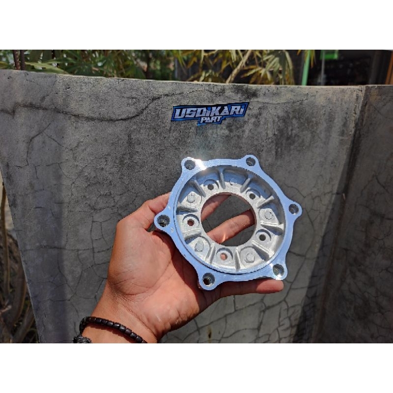 PLENDES ADAPTOR SAMBUNGAN PIRINGAN CAKRAM TROMOL DEPAN SUPRA MEGAPRO MP PRIMUS HIU KODE KCJ BAUT 5