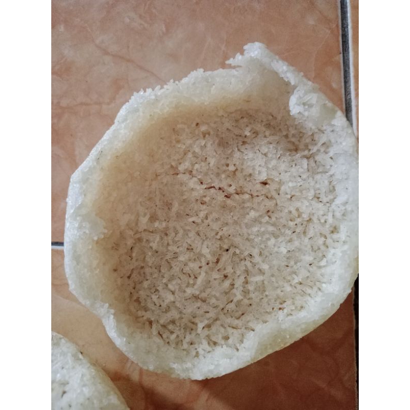 

intip mentah, kerak nasi belum matang per bulatan(satuan)
