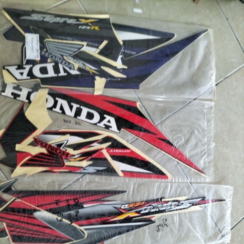 Stiker striping motor supra x 125 tahun 2006
