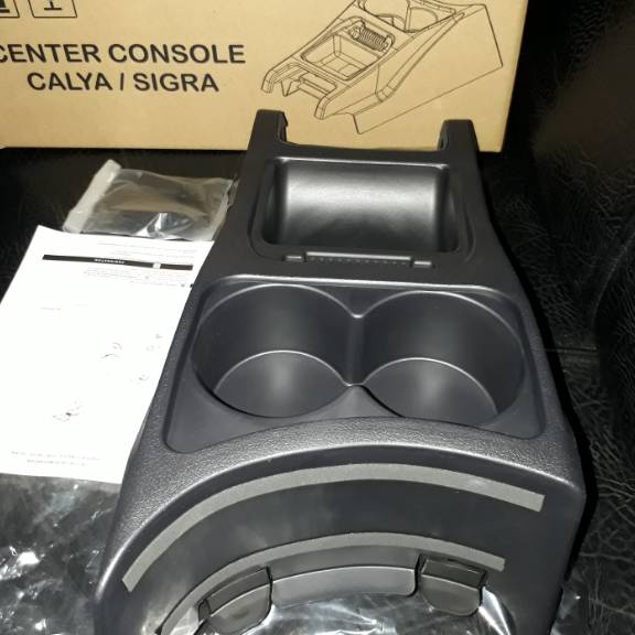 Banyak Peminat CONSOLE BOX CALYA / SIGRA LENGKAP DGN BREKET, RING, BAUT DAN ADA MANUAL BOOK TINGGAL 