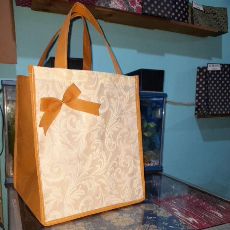 

tas embos motif ( dus 20/22) isi 12 pc