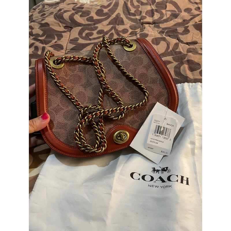 coach saddle parker butik