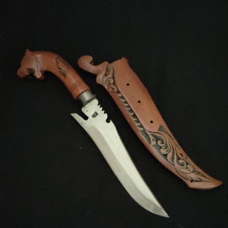 Pisau ladu baja per motif ukiran