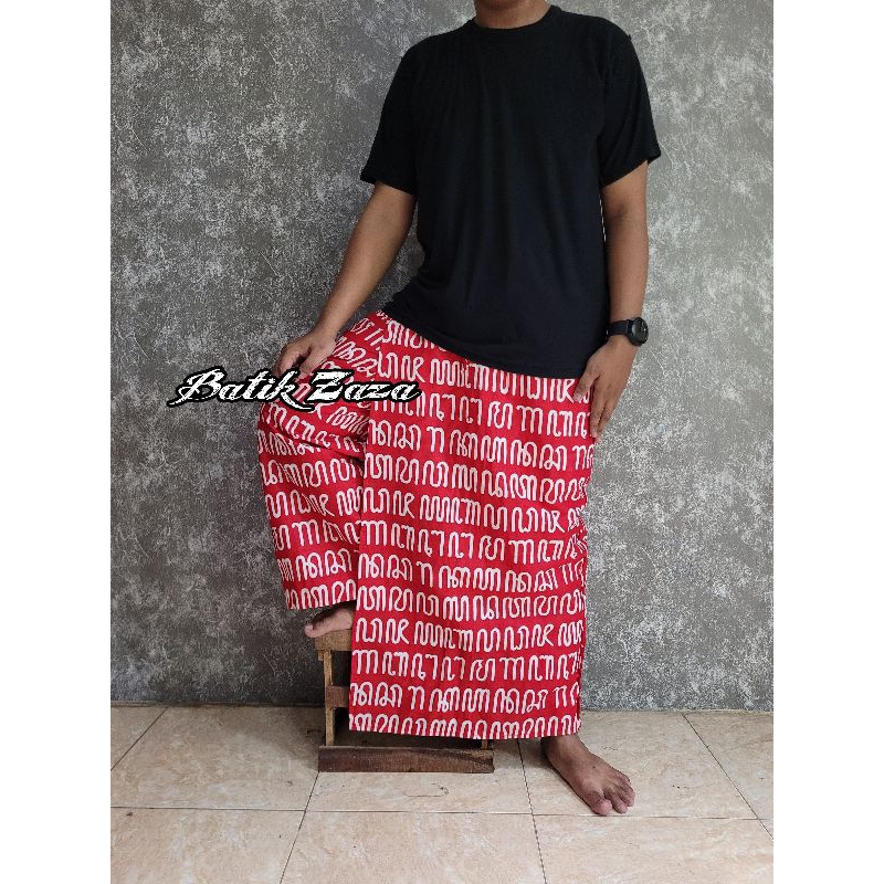 Sarung celana batik motif aksara jawa merah