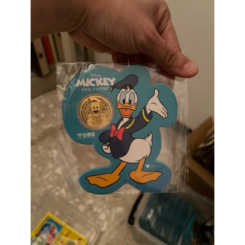 Angpao emas Donald Duck UBS