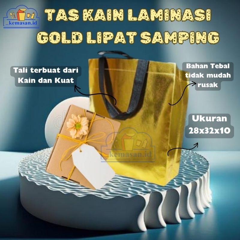 

TAS KAIN LAAMINASI GOLD LIPAT SAMPING 28X32X10