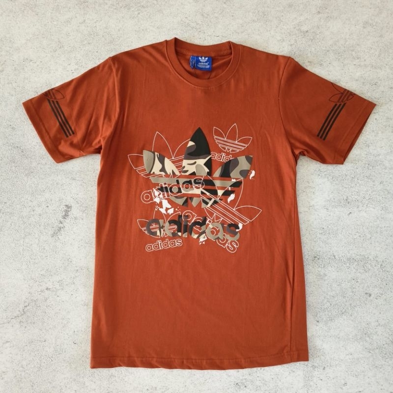 kaos adidas logo bunga merah bata