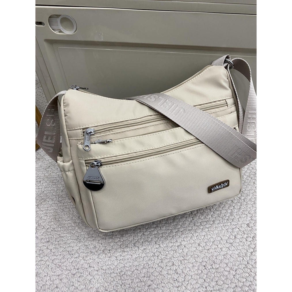 KODE W39F JIELSHI Maya Tas Selempang Wanita Slingbag Berbahan Parasut Premium Furing Full Embos Bran