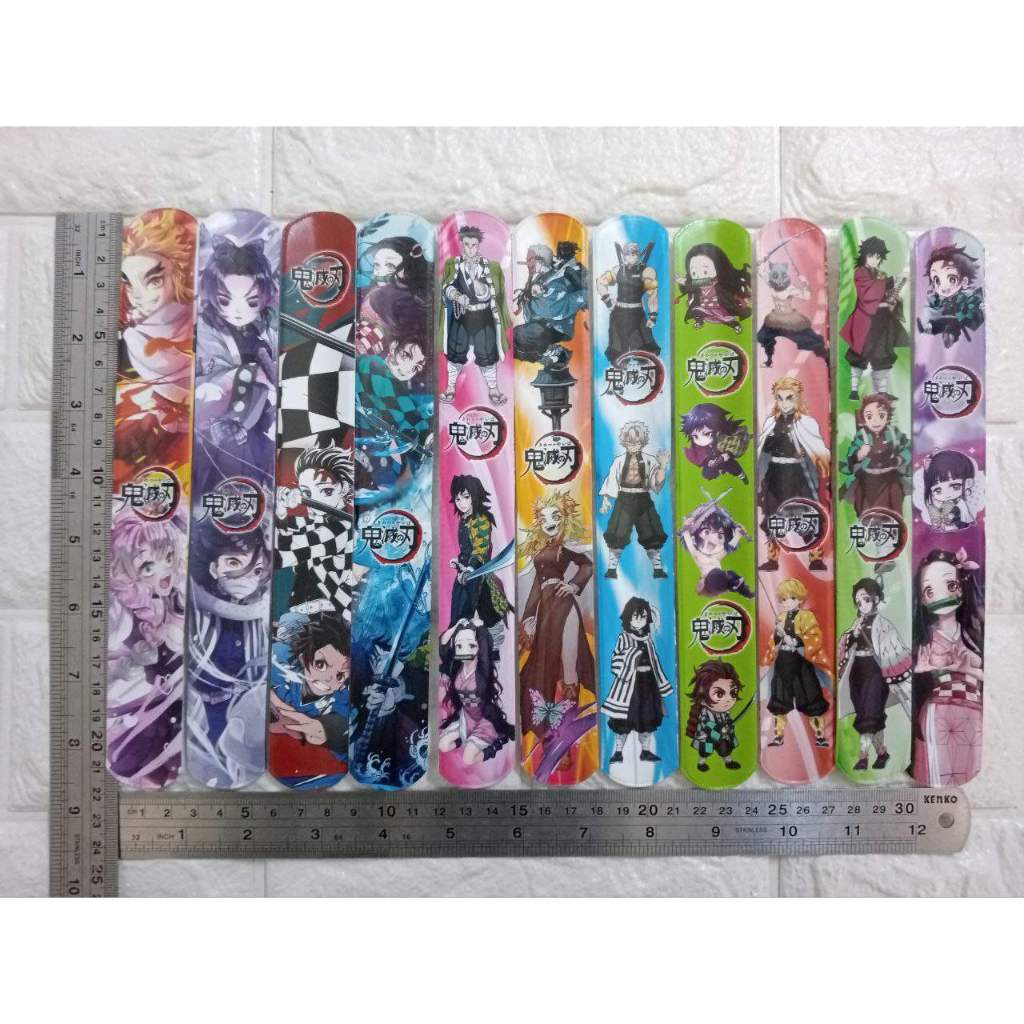 

RB Grosir 50 Pcs Mainan Gelang Penggaris/Gelang Lipat/Gelang Bisa Digulung Motif Demon Slayer