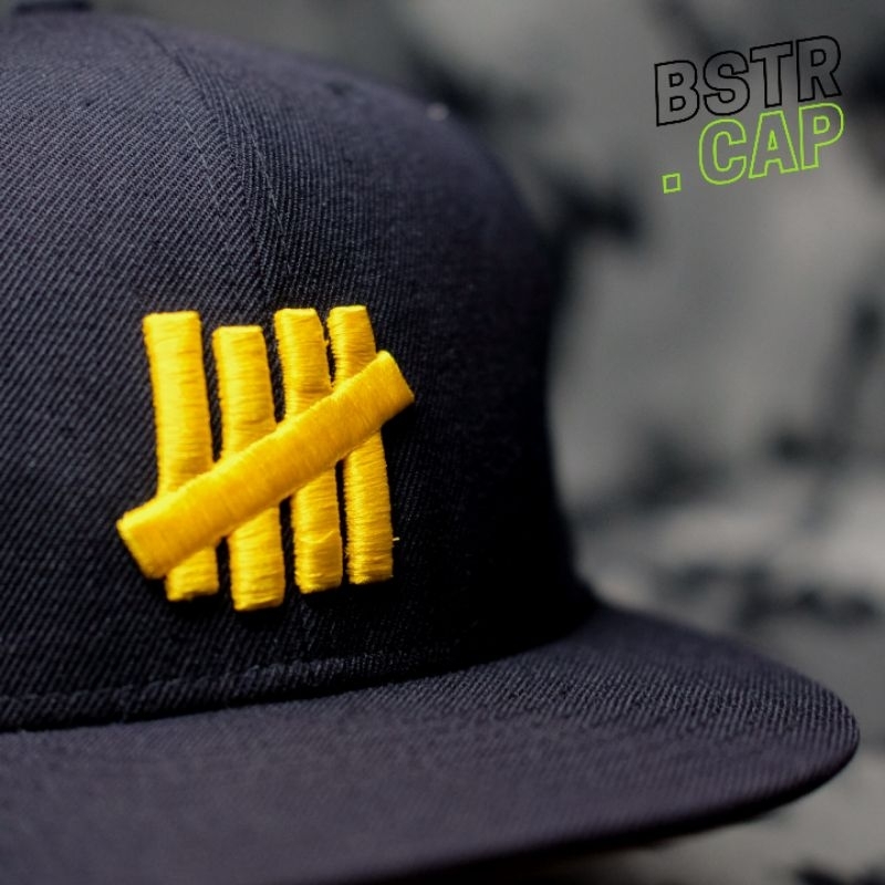 Topi fitted UNDEFEATED x NEW ERA Original navy