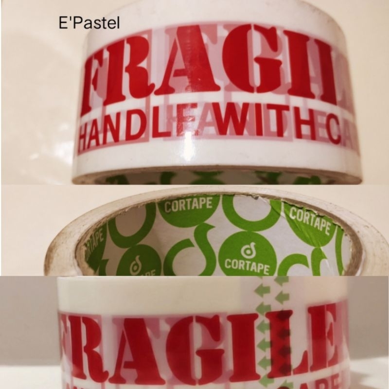

Fragile Hanlde With Care Tape (Isolasi, Lakban Paket) Cortape Semi Trasparan Putih 72 Yard 48 MM
