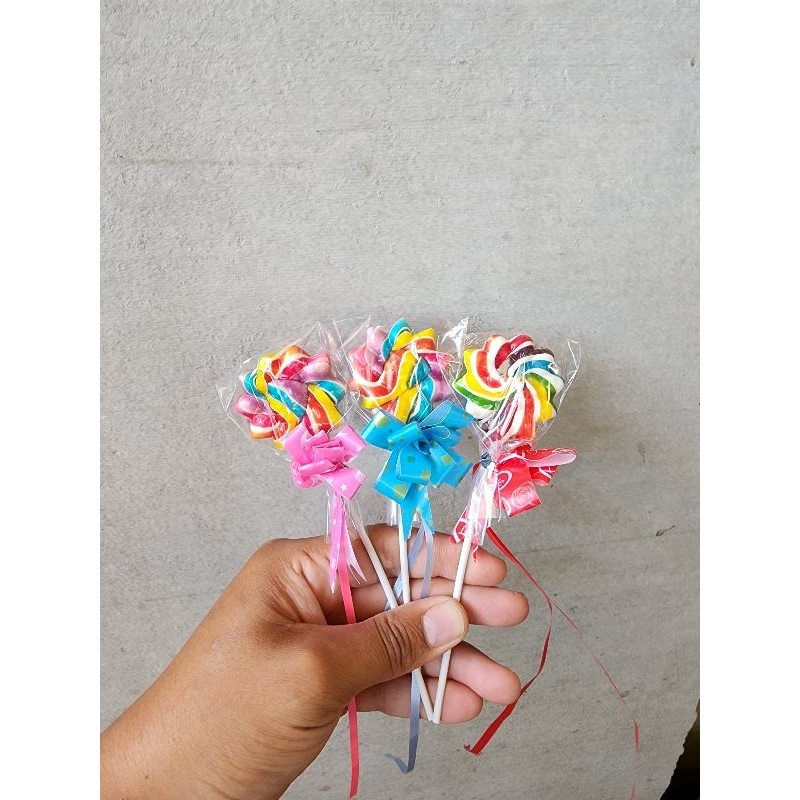 

PERMEN LOLIPOP BUNGA 4 CM HADIAH PITA ISI 20 PCS PERPACK