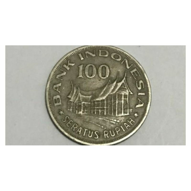 Uang koin 100 rupiah rumah gadang