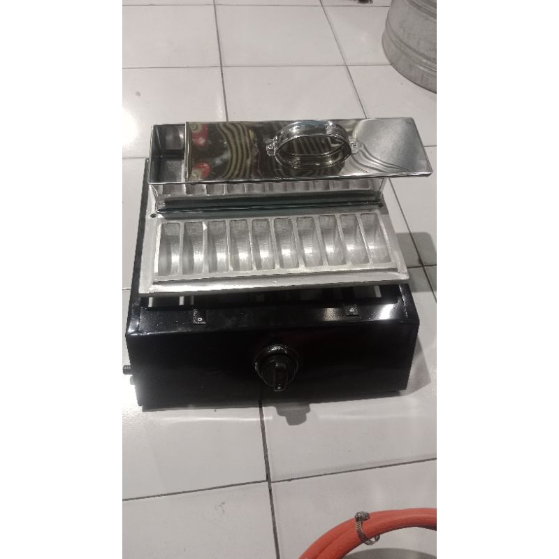 Kompor pematik dan cetakan pukis LKS 7