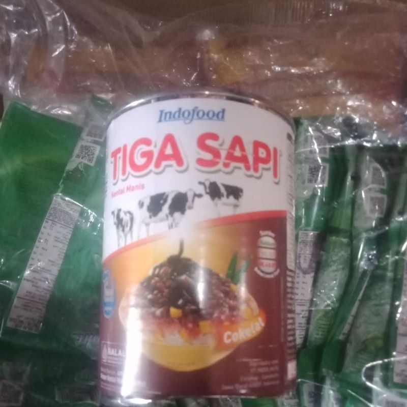 

Susu tiga sapi kaleng coklat