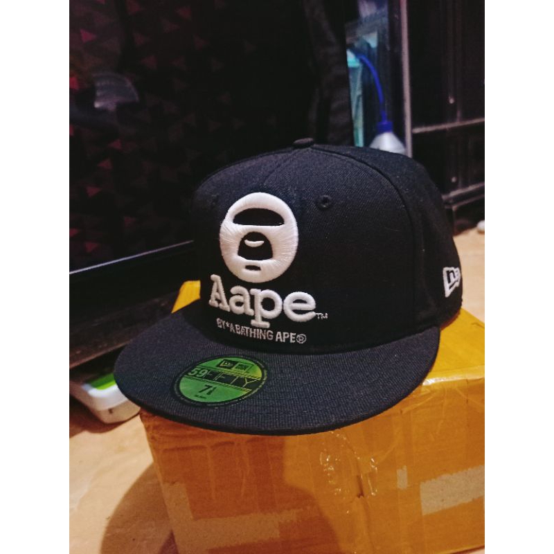 topi New era x aape