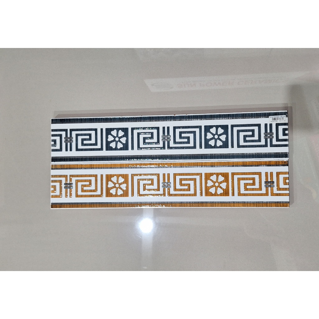 List plin keramik dinding 10x50cm ( big vercace brown & grey)