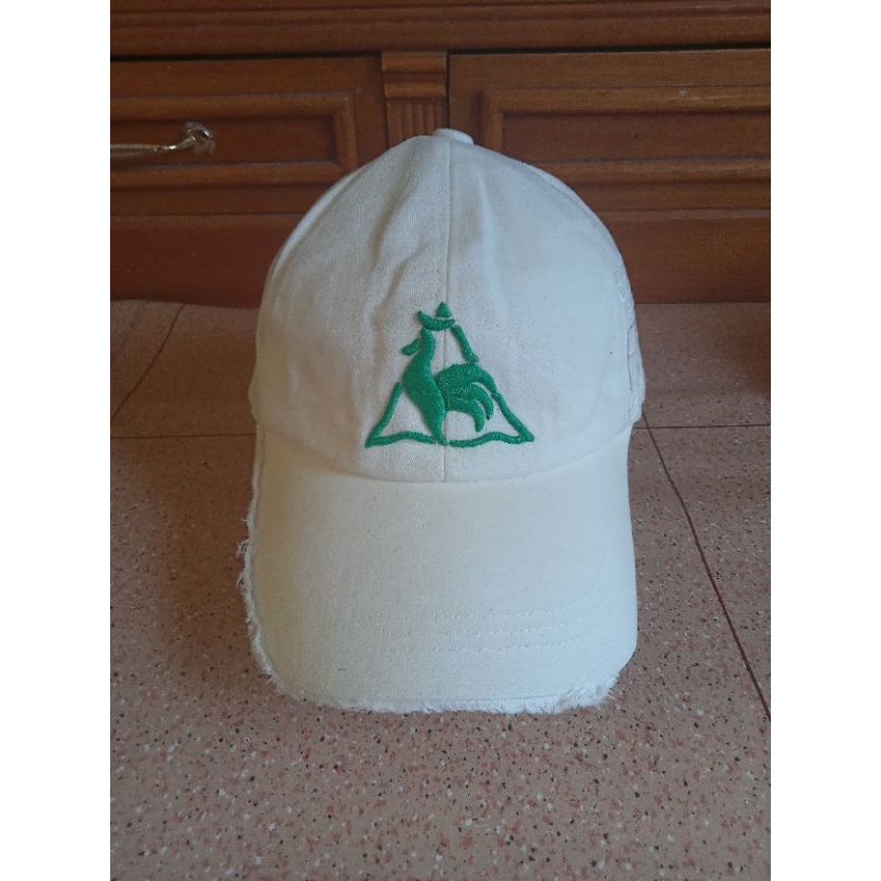 Topi Le Coq Sportif