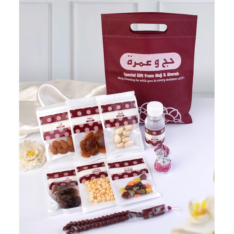 

Lariz Paket Kamil Merah Maron souvenir oleh oleh haji dan umroh lengkap dengan tas premium mewah