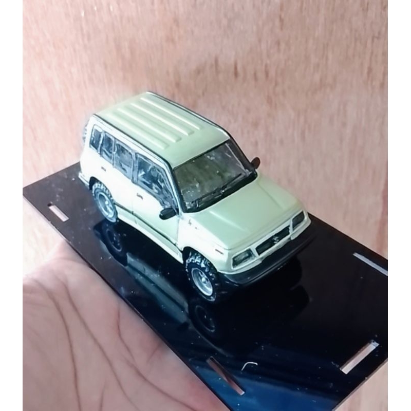 miniatur Suzuki Escudo Vitara Sidekick coklat metalik