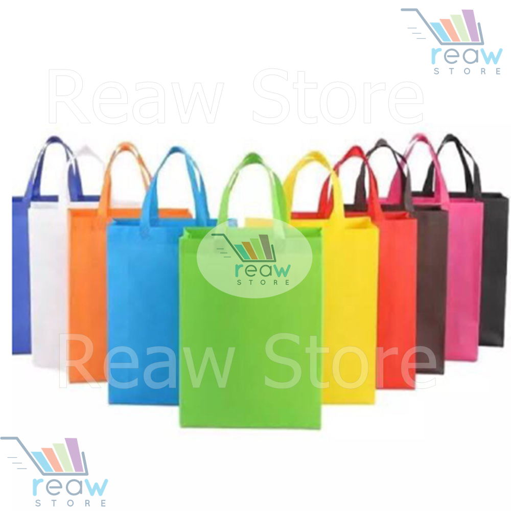 

PER LUSIN Tas Kantong Goodie Bag Kain Spunbond Polos ANEKA WARNA