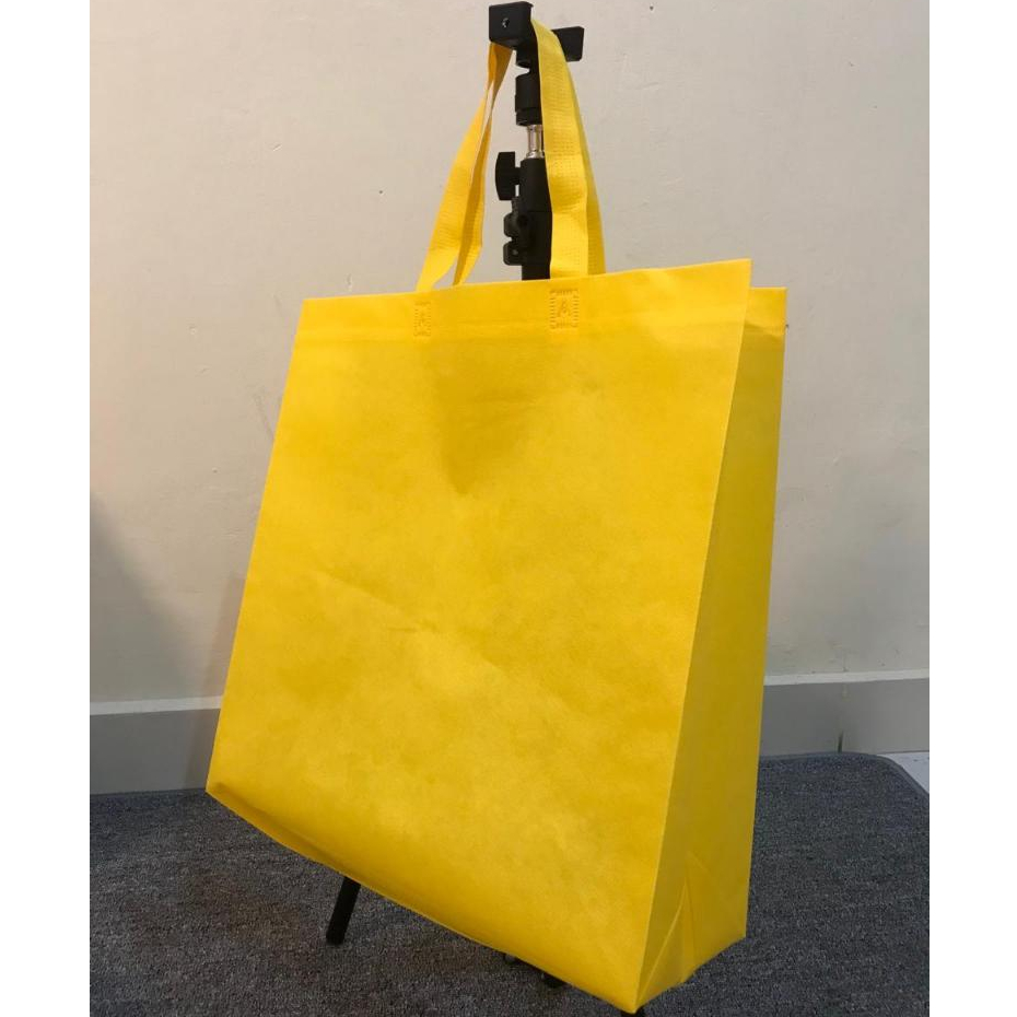 

Goodiebag/spunbond 40x14x40cm kuning kunyit polos