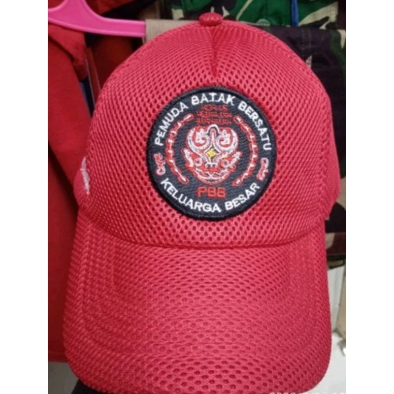 topi jaring merah logo pemuda batak bersatu
