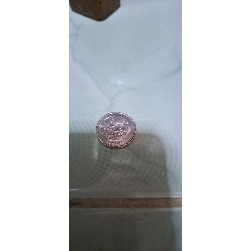 Uang koin 25 rupiah buah pala 1994