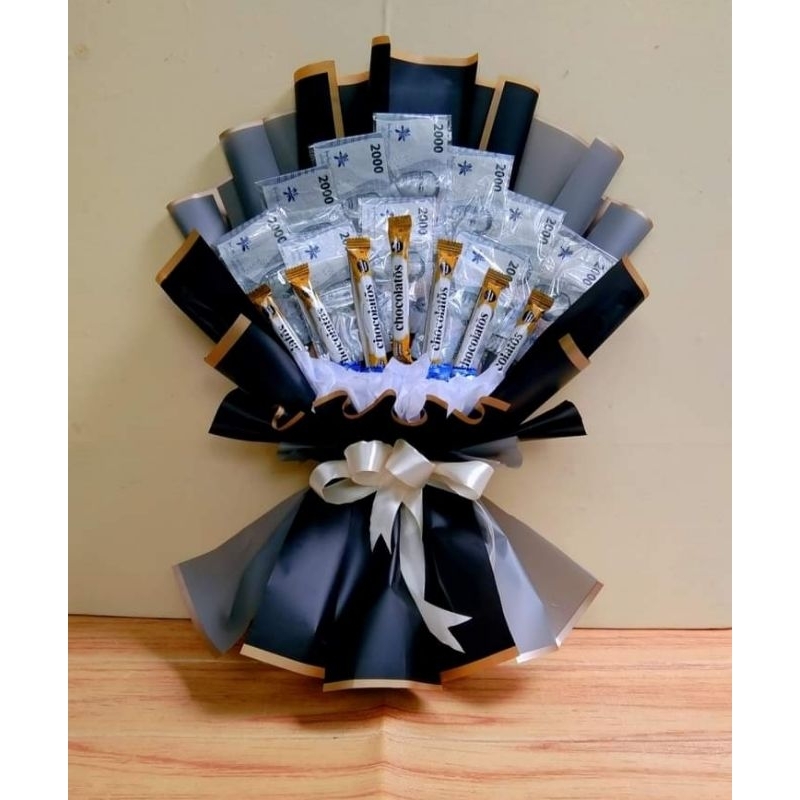 

buket uang asli 2000 (10 lembar) chocolatos dan permen