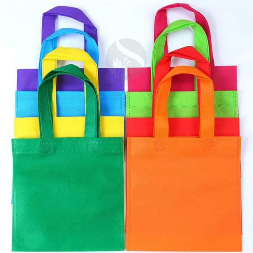 

Tas Spunbond / goodie bag murah tali flat 20x8x26 press / spunbun/tas kain/bento