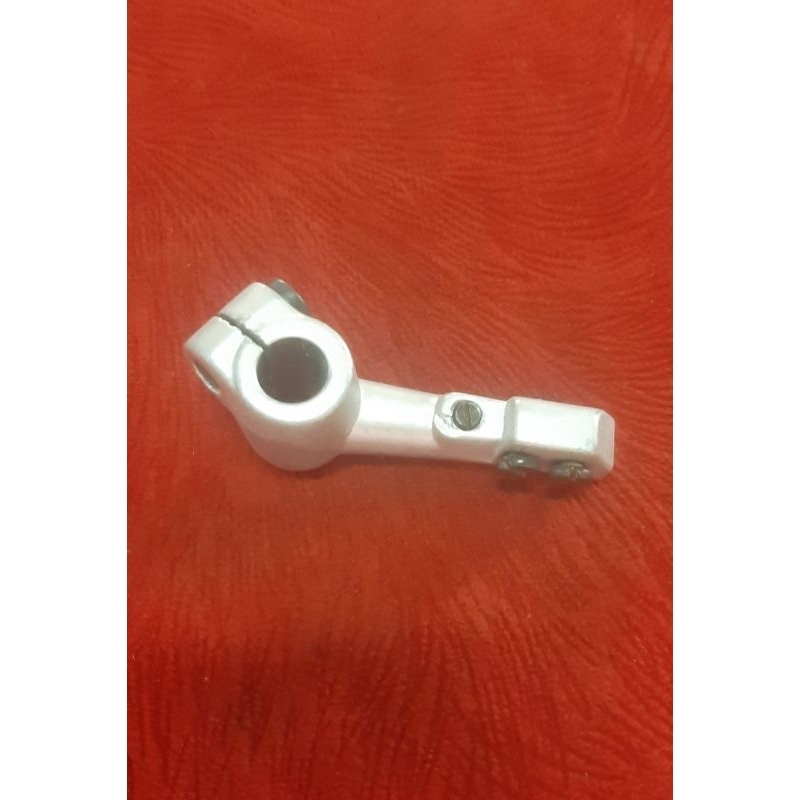 Dudukan loper bawah mesin jahit obras brother 551