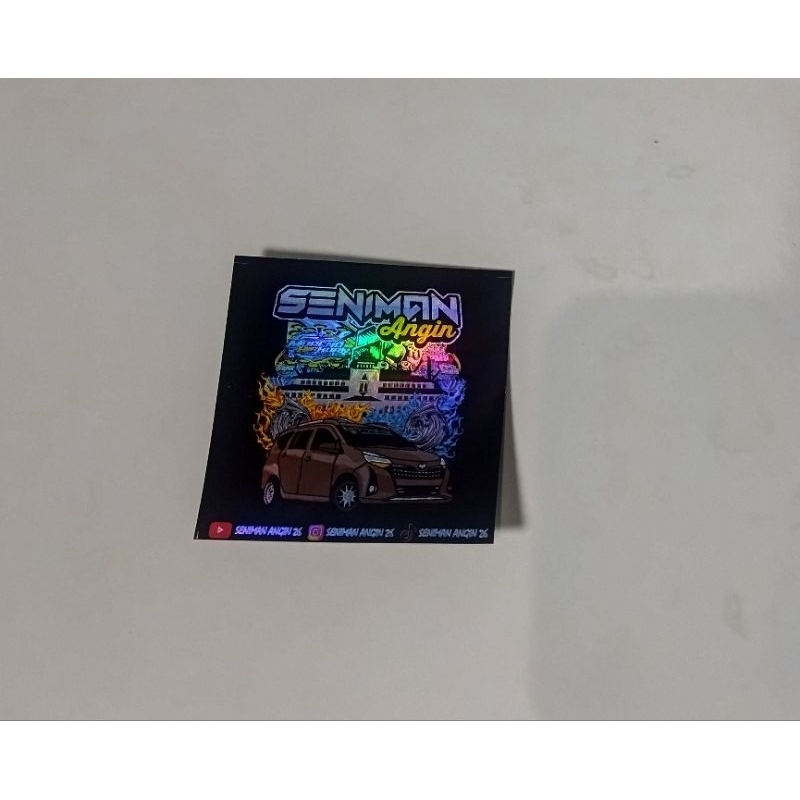 

Stiker Seniman angin hologram